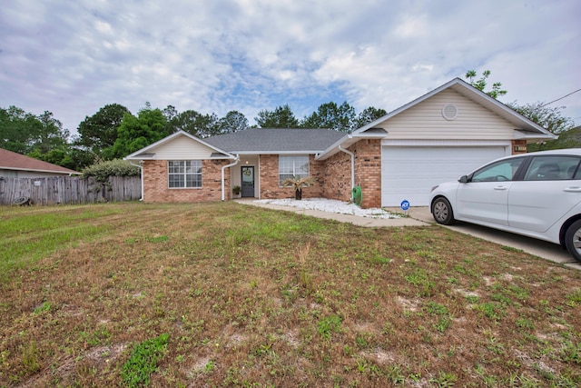 1207 Jefferyscot Dr, Crestview, FL 32536 - single story home with a front yard, a garage, driveway, brick siding, and fence