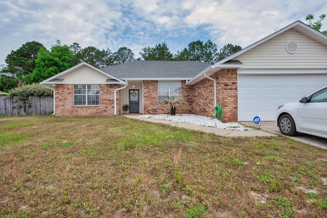 1207 Jefferyscot Dr, Crestview, FL 32536 - ranch-style home featuring fence, a front yard, an attached garage, and brick siding