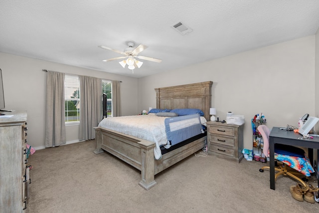 1207 Jefferyscot Dr, Crestview, FL 32536 - bedroom with visible vents, a ceiling fan, baseboards, and light carpet
