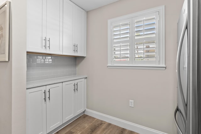 51 Cross Creek Rd Unit 15, Miramar Beach, FL 32550 - bar with wood finished floors, baseboards, freestanding refrigerator, and backsplash