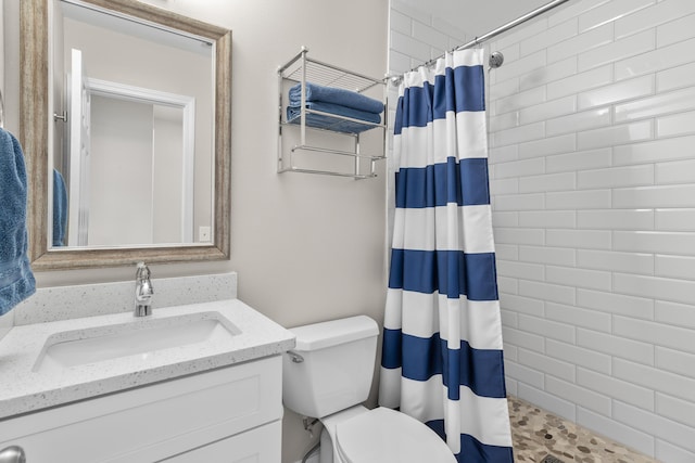 51 Cross Creek Rd Unit 15, Miramar Beach, FL 32550 - bathroom featuring tiled shower, toilet, and vanity