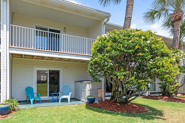 51 Cross Creek Rd Unit 15, Miramar Beach, FL 32550 - back of house with a patio, a balcony, and a yard