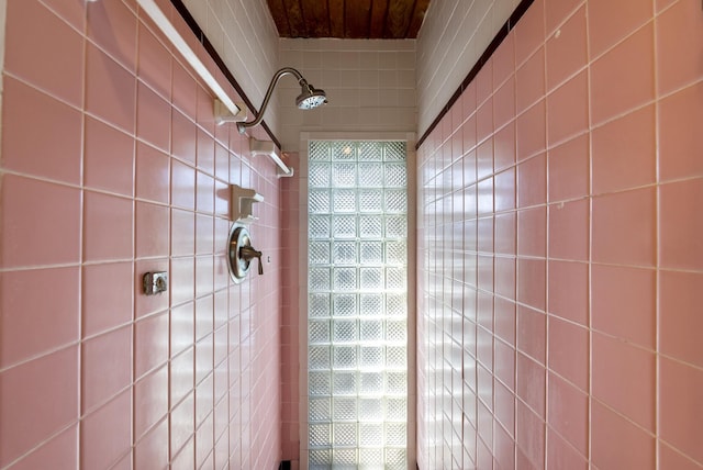 full bath featuring a tile shower