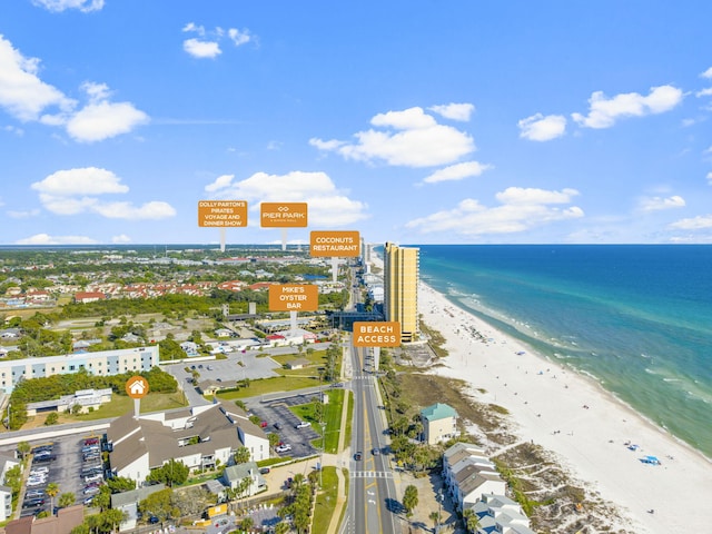 birds eye view of property featuring a view of the beach and a water view