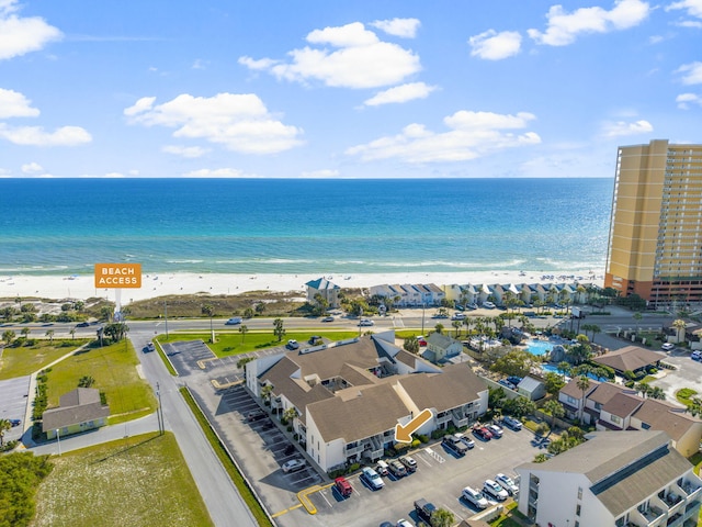 drone / aerial view with a beach view and a water view