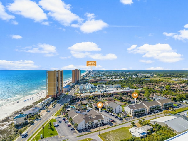 birds eye view of property with a beach view and a water view