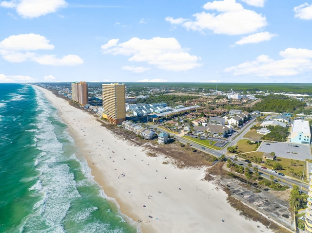 drone / aerial view featuring a view of the beach and a water view