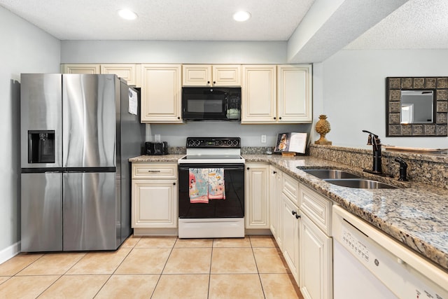 kitchen with a sink, black microwave, electric range, dishwasher, and stainless steel fridge with ice dispenser