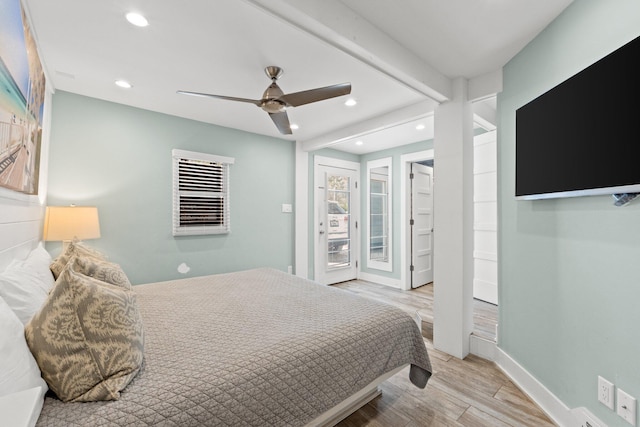 bedroom featuring baseboards, recessed lighting, wood finished floors, a ceiling fan, and access to outside