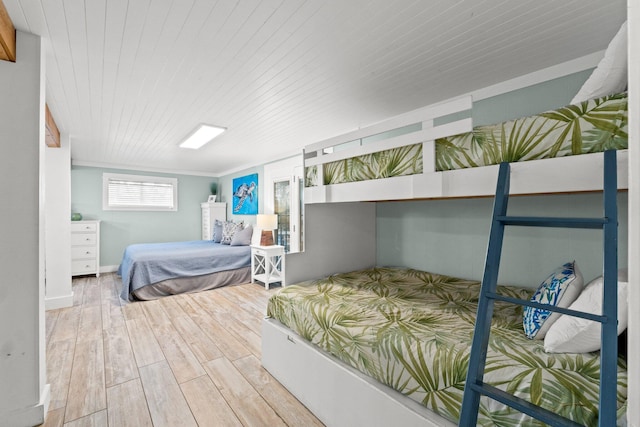 bedroom featuring wood finished floors and wood ceiling