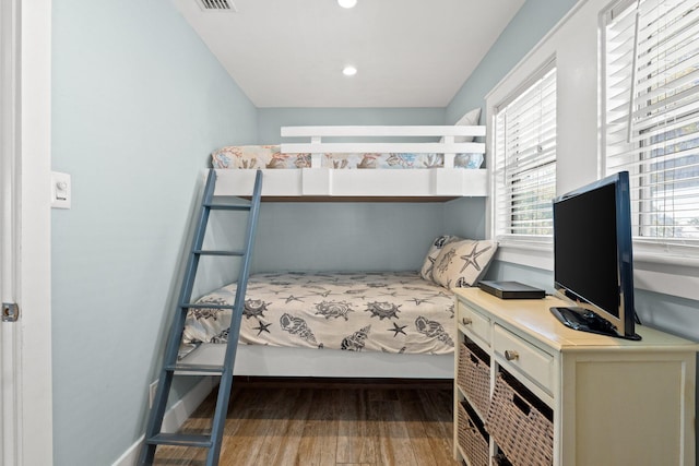 bedroom featuring recessed lighting, visible vents, and wood finished floors