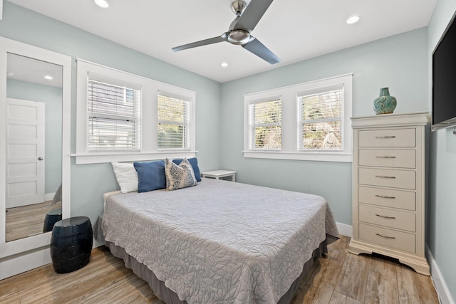 bedroom featuring baseboards, recessed lighting, wood finished floors, and ceiling fan