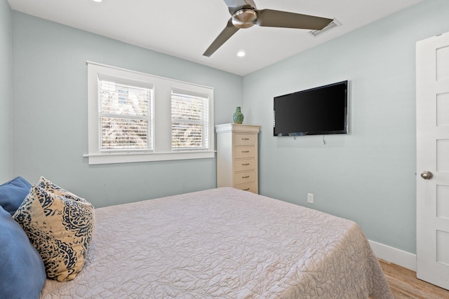 bedroom featuring recessed lighting, wood finished floors, ceiling fan, baseboards, and visible vents