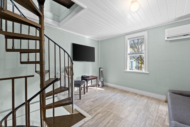 stairs with baseboards, a wall unit AC, wood finished floors, and wood ceiling