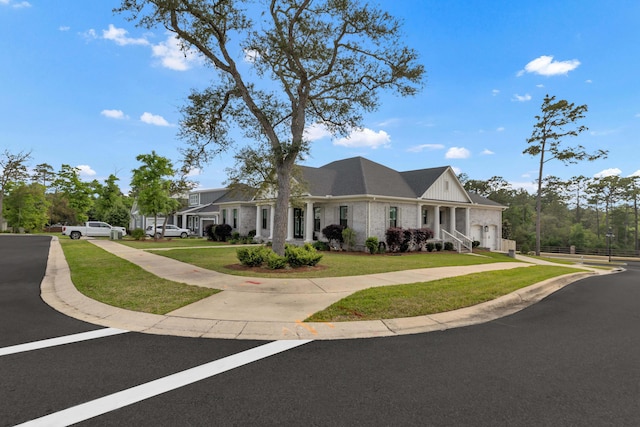 view of front of property with brick siding and a front yard