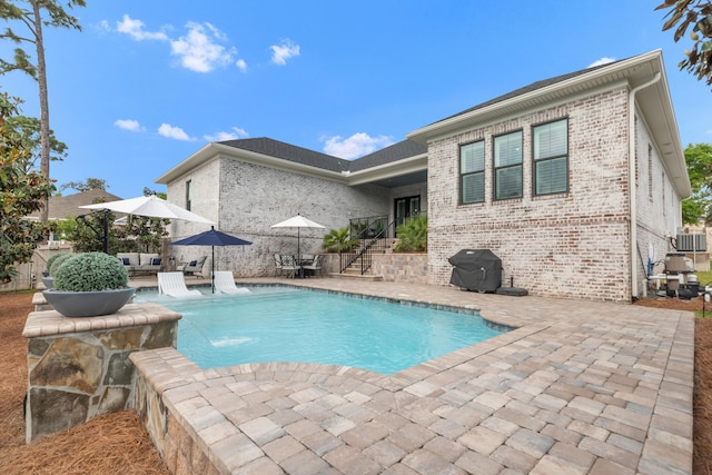 outdoor pool with area for grilling, central air condition unit, an outdoor hangout area, a patio, and stairs
