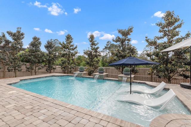 view of pool with a patio, a fenced in pool, a fenced backyard, and a jacuzzi