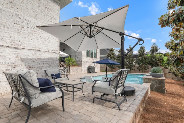 view of patio featuring a fenced in pool and a fenced backyard