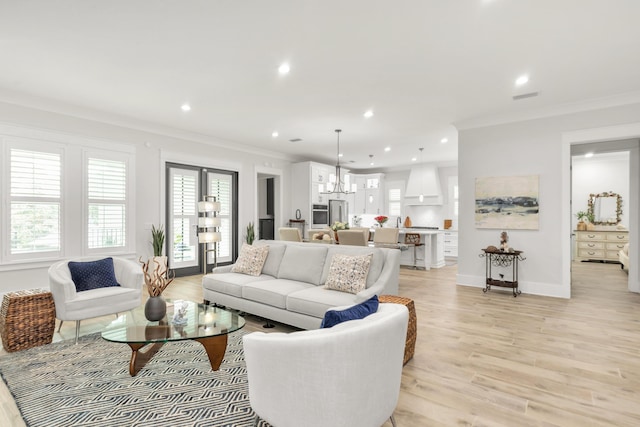 living area featuring crown molding, plenty of natural light, and recessed lighting