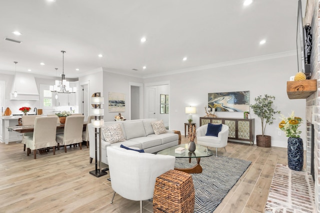 living area featuring a chandelier, visible vents, recessed lighting, and light wood finished floors