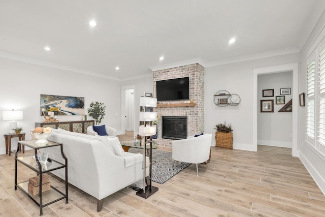living room featuring recessed lighting, a fireplace, and light wood finished floors
