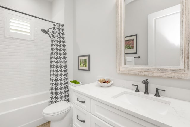 bathroom with toilet, shower / bath combo with shower curtain, and vanity