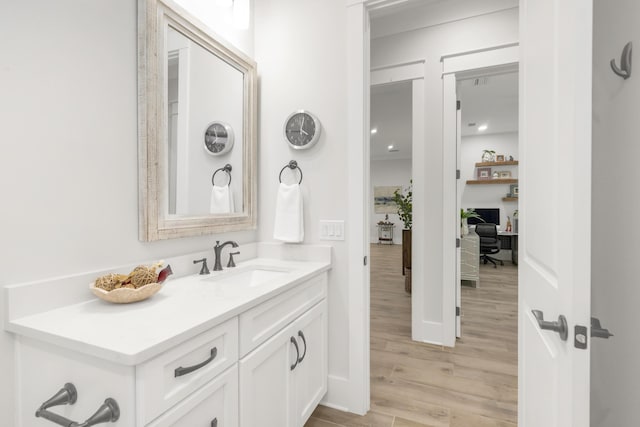 bathroom featuring vanity and wood finished floors