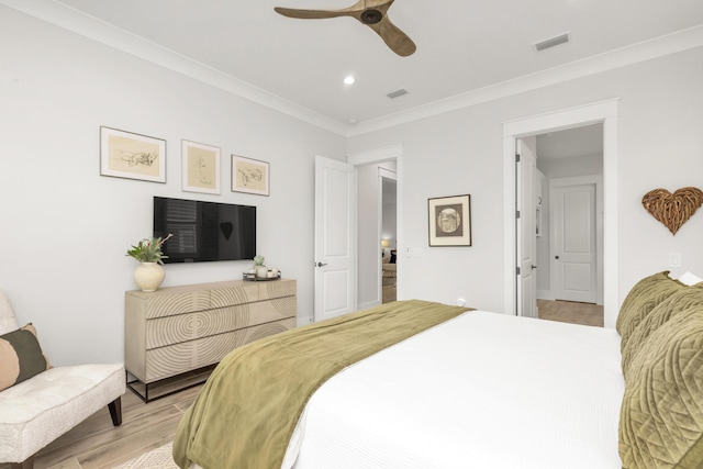 bedroom with light wood-style floors, crown molding, recessed lighting, and visible vents