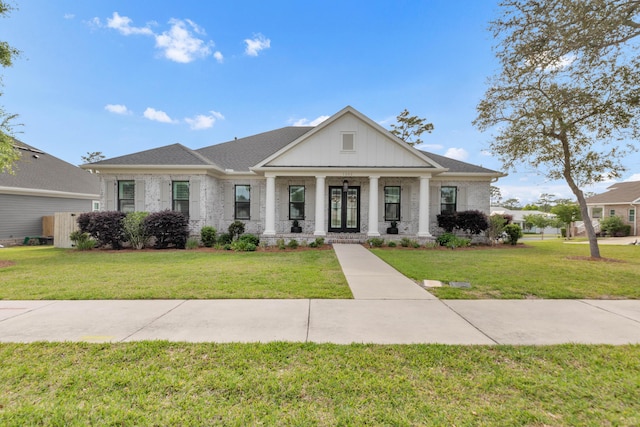 neoclassical / greek revival house featuring brick siding and a front lawn