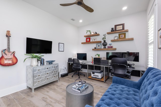 office space featuring a ceiling fan, a wealth of natural light, and wood finished floors