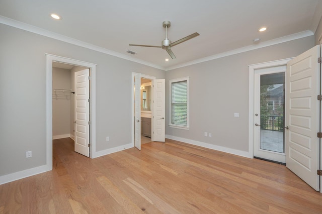 unfurnished bedroom with baseboards, ornamental molding, light wood finished floors, and visible vents