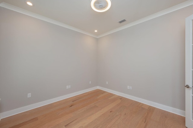 spare room featuring crown molding, visible vents, baseboards, recessed lighting, and light wood-style flooring