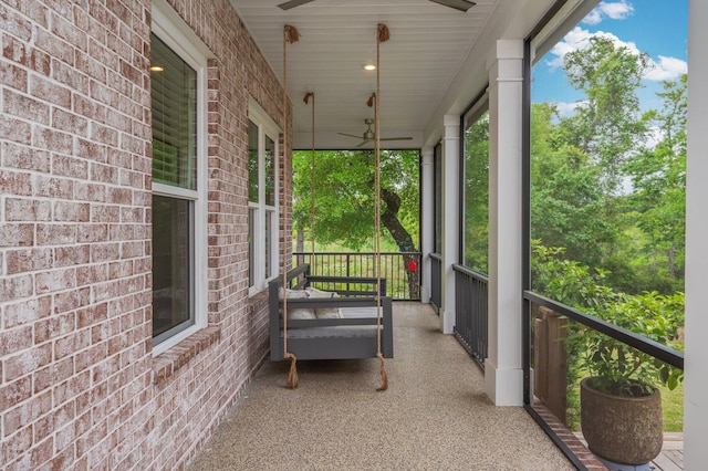balcony with ceiling fan and covered porch
