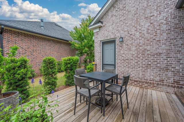 wooden deck with outdoor dining space