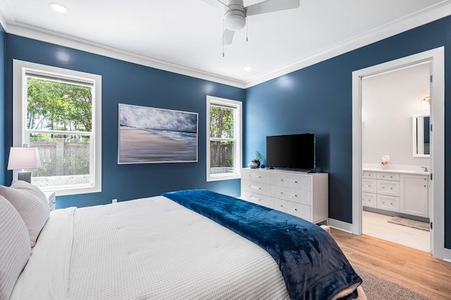 bedroom with light wood-style floors, ornamental molding, connected bathroom, ceiling fan, and recessed lighting