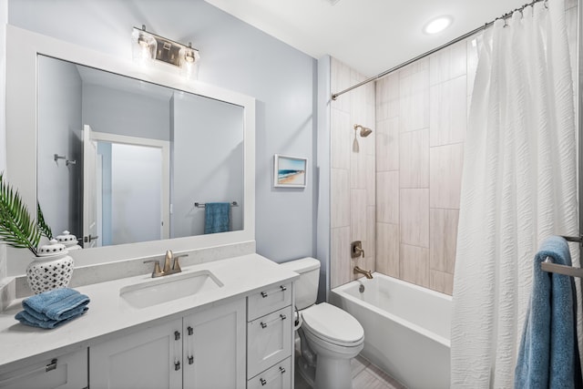 full bathroom with vanity, shower / bath combo with shower curtain, and toilet
