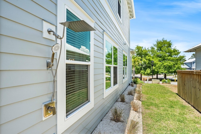 view of home's exterior with a yard
