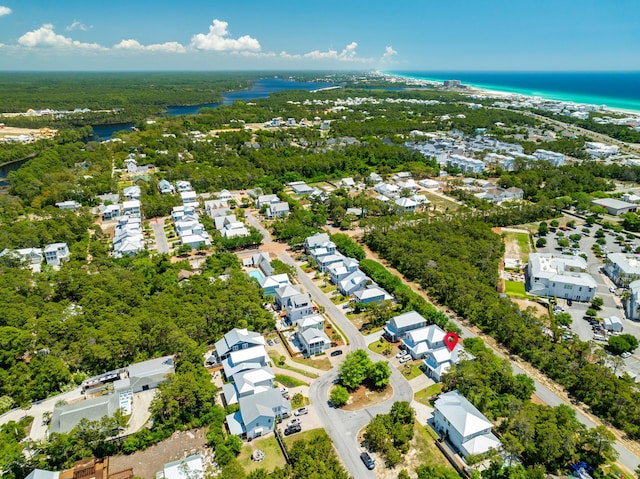 aerial perspective of suburban area with a large body of water