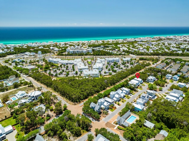 aerial view of residential area featuring a nearby body of water