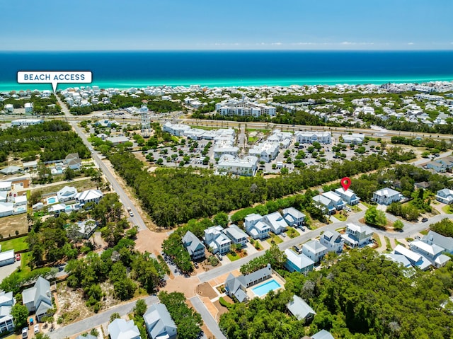 aerial perspective of suburban area featuring a nearby body of water