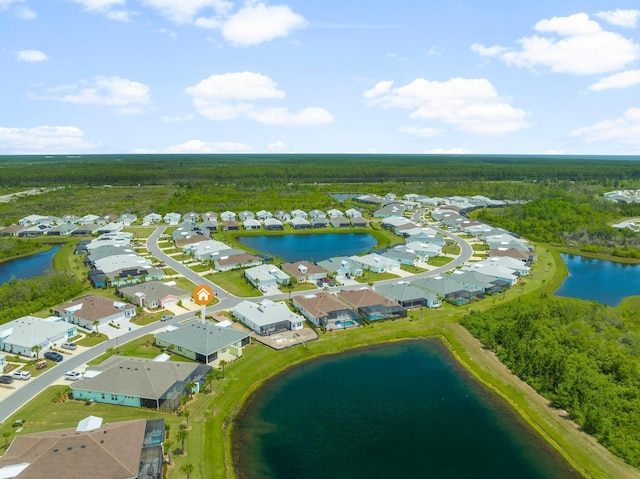 bird's eye view featuring a residential view, a water view, and a forest view