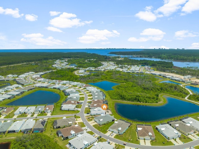 bird's eye view featuring a water view and a residential view