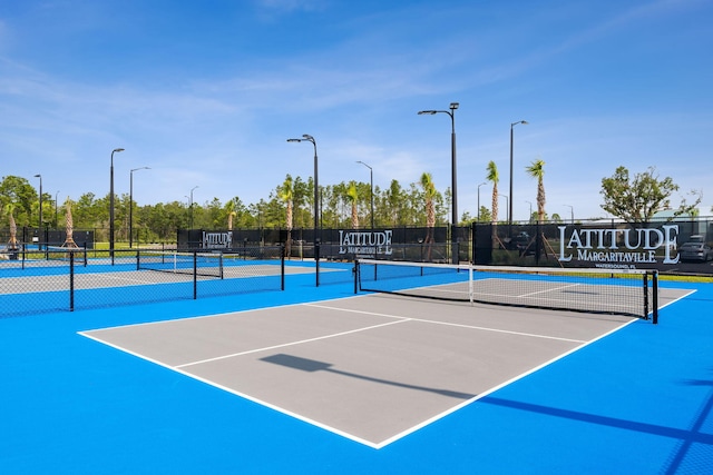 view of sport court with fence and community basketball court