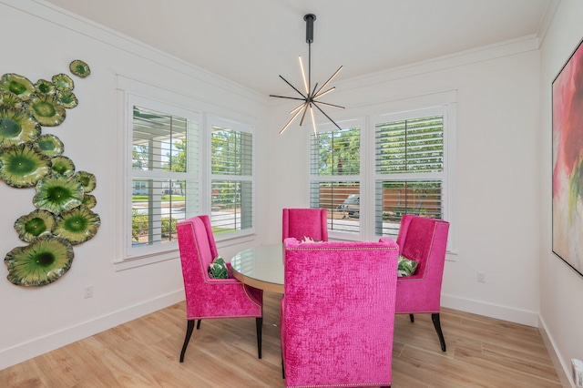 65 Horseshoe Cir, Miramar Beach, FL 32550 - dining space featuring crown molding, baseboards, light wood-style floors, and a notable chandelier