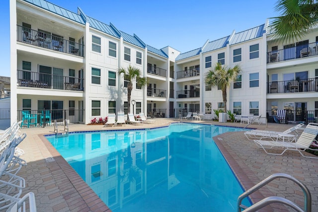 pool featuring a patio area