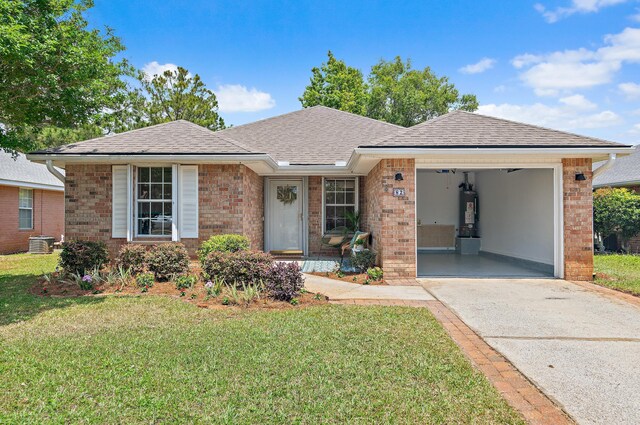 ranch-style house featuring a front lawn, brick siding, a garage, water heater, and driveway
