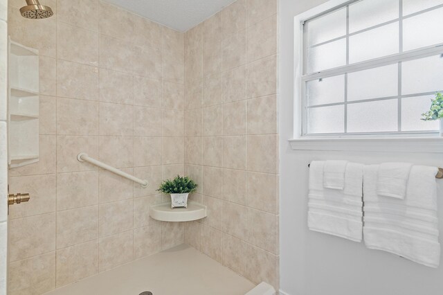bathroom featuring tiled shower