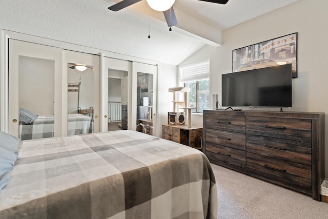 carpeted bedroom with ceiling fan and vaulted ceiling with beams
