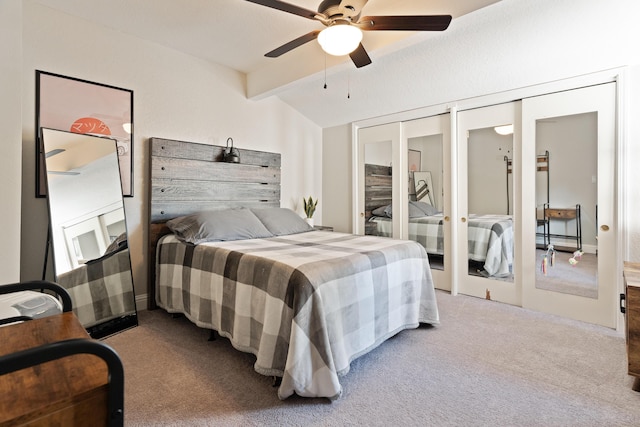 carpeted bedroom featuring ceiling fan, a baseboard heating unit, and vaulted ceiling with beams