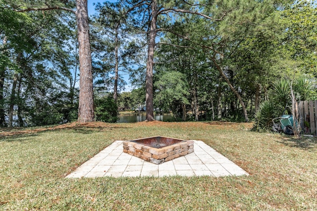 view of yard featuring a patio and a fire pit